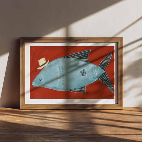 Framed artwork of a fish wearing a hat on a red background