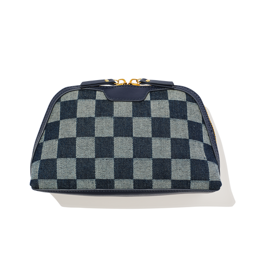 Checkered blue and gray bag with gold zipper on a white background