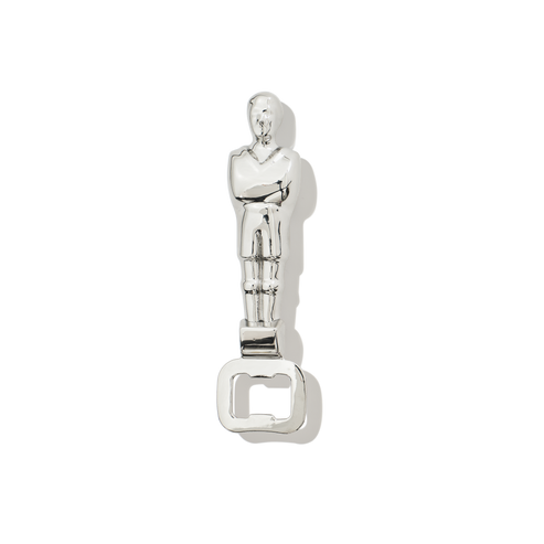 Silver bottle opener shaped like a classic movie statue on a white background