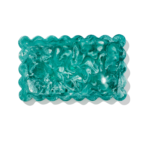 Turquoise-colored jelly candy on a white background